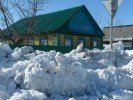 Дома на Оренбургской зарываются в снег