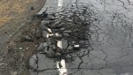 Грузовые автомобили разрушают дорогу до Новониколаевки
