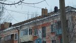 Зима. На ул. Ленина разбирают крышу